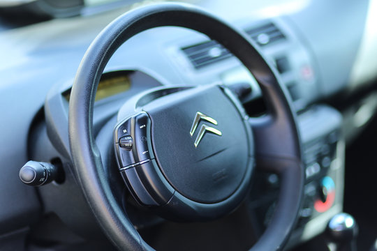 Citroen C4 modern steering wheel close up with brand logo