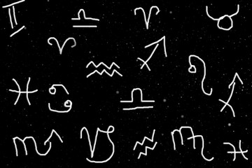 Fototapeta na wymiar Astrological symbols in the cosmic sky