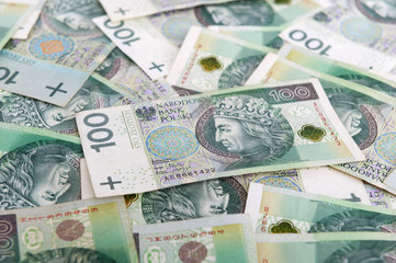 Fototapeta na wymiar Polish money background. 100 Polish zloty bills pile. Republic of Poland currency