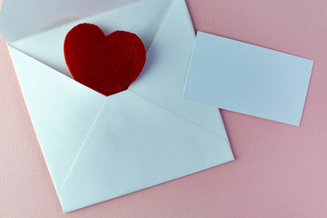 Envelope with red heart inside and a card with place for text for valentine day or other holiday to...