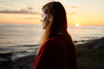 woman on the beach at sunset