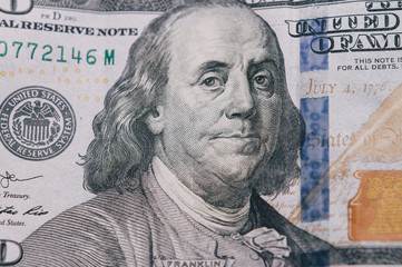 Macro photo of 100 dollar. Paper texture.