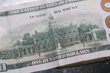Macro photo of 100 dollar. Paper texture.