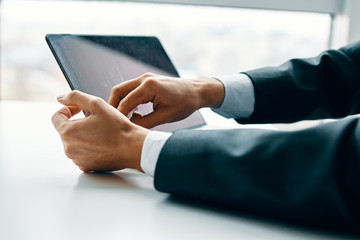 man using digital tablet