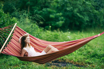woman relaxing in hammock
