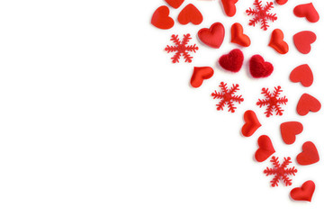 Festive composition from red hearts and snowflakes scattered and isolated on white background