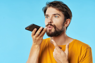 portrait of young man with mobile phone