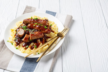 Bangers and Mash with Onion Gravy on a plate