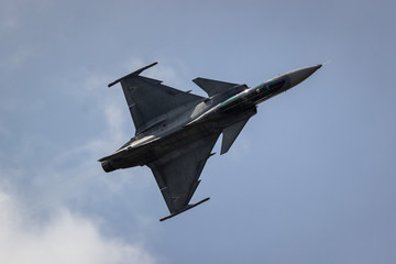 Fototapeta na wymiar F16 rotating in air during airshow