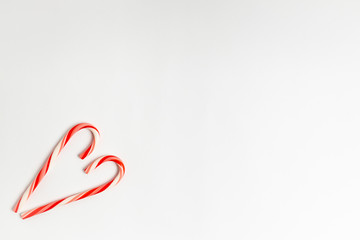 red candy cane heart on white background