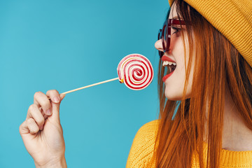 girl with lollipop on white background