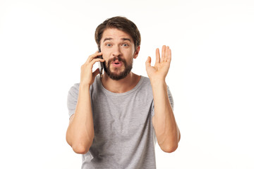 young man talking on the phone isolated on white