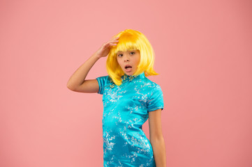 Hobby and entertainment. Pop culture. Anime fan. Child cute cosplayer. Anime emotional expression. Anime admirer. Girl yellow wig. Cosplay character concept. Japanese style. Eastern trends for teens
