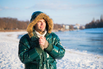 exploring nature. place for thoughts. cold and loneliness. male in down coat with fur hood. feel warm and comfortable. guy green puffer coat. man enjoy winter landscape. nature is beautiful © be free