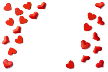 Festive composition from red hearts scattered and isolated on white background