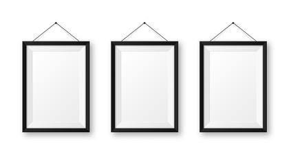 Realistic hanging on a wall blank black picture frame with shadow. Modern poster mockup isolated on white background. Empty photo frame for art gallery or interior. Vector illustration.