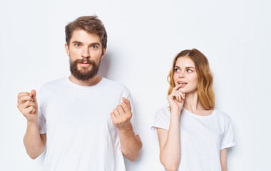 young couple pointing at something