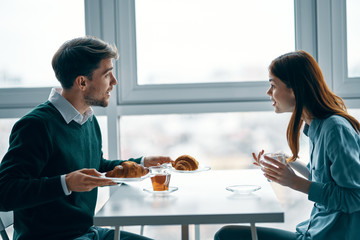 couple having breakfast in the kitchen