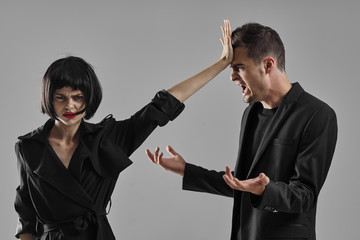 man and woman fighting with gun