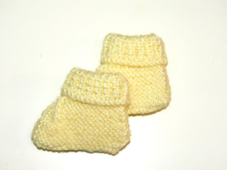  handmade yellow and white booties for babies