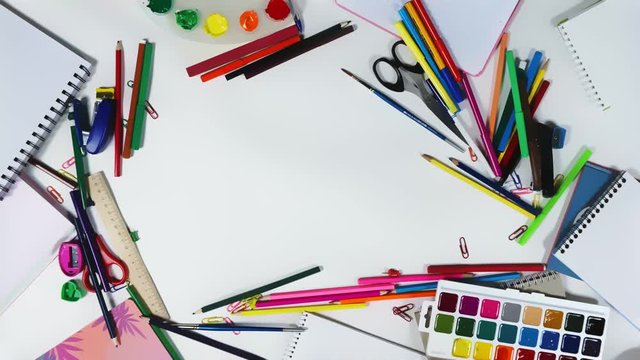 Animation of stationery on desktop of an artist or designer, logo intro looped stop motion. Stationery theme for company branding. Concept of a set of items to promote tools for drawing and creativity