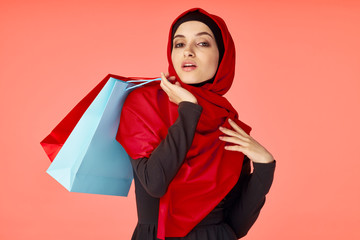 young woman with shopping bags