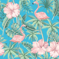 Wall murals Botanical print Tropical pink hibiscus and flamingo floral green palm leaves seamless pattern blue background. Exotic jungle wallpaper.