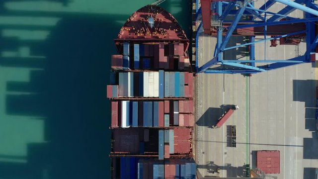 Aerial view. Container ship loading and unloading in deep sea port.
