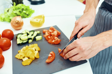 woman cutting vegetables in the kitchen