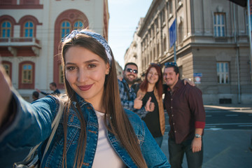 Group of friends making selfie