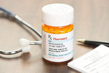 Generic Metroprolol Prescription on physician's desk with stethoscope and prescription pad