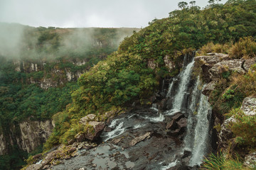 Black Tiger Waterfall on cliff with mist