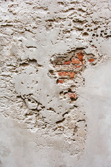 Red brick wall with crashed white plaster background, abstract urban rough pattern