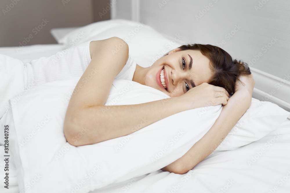 Canvas Prints young woman lying on bed