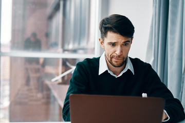 portrait of a businessman with laptop