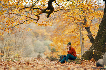 Naklejka na ściany i meble man in autumn forest