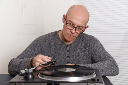 man  listens to records