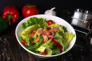 smoked salmon salad with dark background