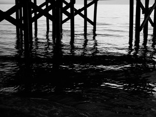 Lower Pier at Dusk With Incoming Tide - BW