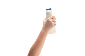 Kid Hand holding Bottle of fresh milk  isolated on white.