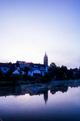 Telc village at sunrise on the water