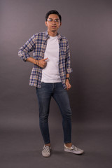 Portraiture of Asian boy with casual out fit.Studio shot.