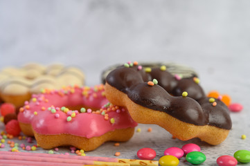 Strawberry and chocolate donuts are placed on top.
