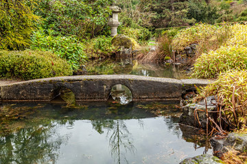 Fototapeta na wymiar small stone bridge in japanese garden