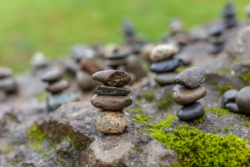 small cairns stacked on larger rock