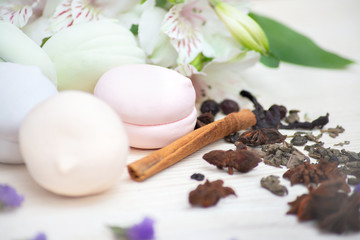 delicate photo of French marshmallows decorated with seasonings and flowers