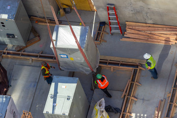 construction workers at a large building site