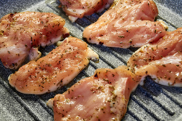 pieces of fried chicken breast. Grilled poultry steak cooked on a grill pan