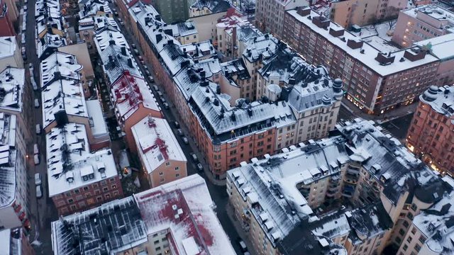 Roof tops in Stockholm City covered in snow. Aerial birds eye view.