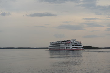 Passenger ship "Viking Helgi" is at the end of the day, in the Sheksninskoe reservoir. Vologda region